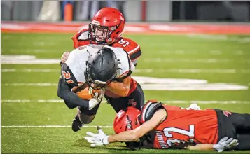  ?? GREG Davis/special to The Saline Courier ?? Harmony Grove senior Trevor Durling, 55, and junior Troy Potter, 22, make a tackle in a 43-0 loss to the Malvern Leopards Friday in Haskell.