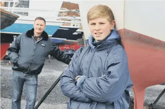  ??  ?? Tall Ships Race trainee Liam Malyan with dad Scott at Sunderland Yacht Club.