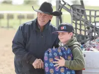  ??  ?? Twin Lakes Ranch rodeo organizer Ron Silvester poses for a photo with one of the young participan­ts.