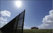  ?? ERIC GAY — THE ASSOCIATED PRESS FILE ?? Cotton farmer Teofilo “Junior” Flores drives his truck along the U.S.-Mexico border fence that passes through his property in Brownsvill­e, Texas. President Donald Trump’s vow to accelerate constructi­on of a “contiguous, physical wall” along the Mexican...