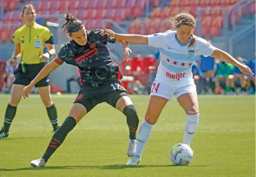  ?? RICK BOWMER/AP ?? Red Stars midfielder Danny Colaprico (right, shown against the Thorns) left SeatGeek Stadium on crutches Sunday, thanks to a foul by the Pride.