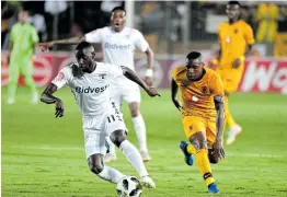  ?? Picture: GALLO IMAGES/ LEE WARREN ?? SILENT TREATMENT: Deon Hotto, left, of Bidvest Wits tries to control the ball under the watchful eye of George Maluleka of Kaizer Chiefs during a PSL match in 2019. Amakhosi will feel the loss of their boisterous fans when they take on Wits on Wednesday night.