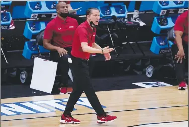  ?? Associated Press ?? Reaction: Arkansas head coach Eric Mussleman watches against Baylor during the first half of an Elite Eight game in the NCAA men's college basketball tournament Monday at Lucas Oil Stadium in Indianapol­is.