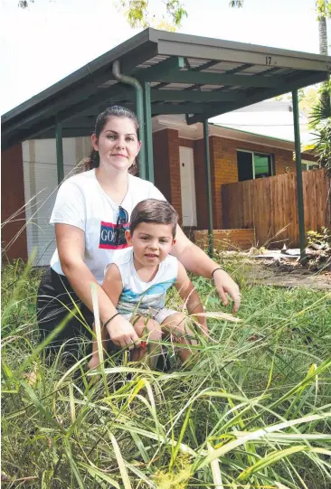  ?? Picture: ANNA ROGERS ?? NEIGHBOURS: Palm Cove resident Kaela Parker and her son Lyndon Van Doorn, 4, in front of one of the houses in her street which will be demolished to make way for an Airbnb.