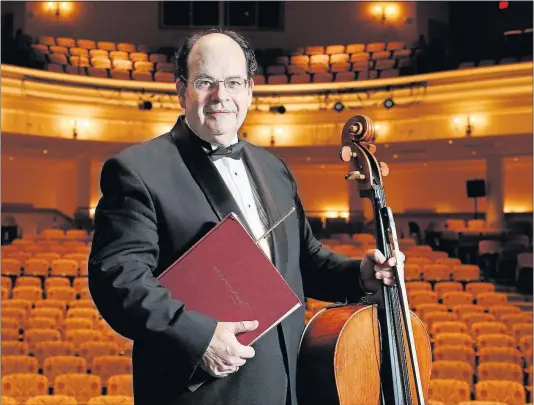  ?? [BARBARA J. PERENIC/DISPATCH] ?? Luis Biava, principal cellist for the Columbus Symphony, conducts the orchestra during BalletMet performanc­es of “The Nutcracker” and also leads the New Albany Symphony Orchestra, which performs at the McCoy Center for the Arts.