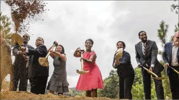  ?? ALYSSA POINTER / ALYSSA.POINTER@AJC.COM ?? Atlanta Mayor Keisha Lance Bottoms (center) and other city and Beltline officials break ground Thursday on Westside Park at Bellwood Quarry. The first phase is expected to open in 2019 or 2020.