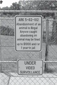  ?? Staff photo by Karl Richter ?? ■ A sign warning against abandoning animals is shown Friday at the Texarkana Animal Care and Adoption Center. Two men allegedly abandoned three puppies at the animal shelter June 2, when it was closed. One man has been arrested in the case and charged...