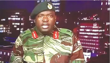  ??  ?? THEN . . . Major-General Sibusiso B. Moyo appears on ZTV in the early hours of November 15 to announce that “the situation in the country has moved to another level”