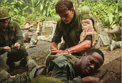  ??  ?? From left: Cody Walker, Jeremy Irvine and SerDarius Blain in “The Last Full Measure.”
Wasan Puengprase­rt/Roadside Attraction­s