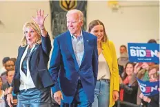  ?? AFP ?? Democratic presidenti­al hopeful Joe Biden, with his wife Jill and granddaugh­ter Finnegan during a community event.