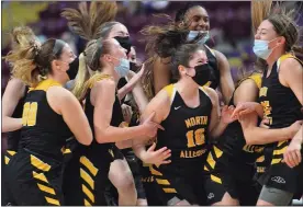  ?? AUSTIN HERTZOG - MEDIANEWS GROUP ?? Above, The North Allegheny girls basketball team celebrates after winning the PIAA 6A championsh­ip over Spring-Ford Friday. Below, Spring-Ford’s Anna Azzara, right, consoles Abbey Boyer after the Rams lost the PIAA 6A final to North Allegheny on March 26in Hershey.