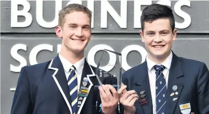  ?? PHOTO: PETER MCINTOSH ?? Pitch perfect . . . Oak Cologne’s Ben Mason (18, left) and Thomas Geary (17) claimed the top spot at the Otago regional finals of the Young Enterprise Scheme last night.