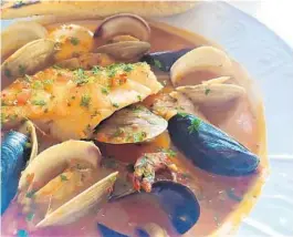  ?? AMY DREW THOMPSON/ORLANDO SENTINEL ?? The Osprey’s cioppino packs a surprising level of heat and loads of seafood.