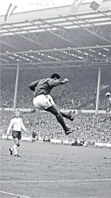  ??  ?? Classic duel: Nobby Stiles blocks a Eusebio header during England’s 2-1 win against Portugal at Wembley in 1966 – the striker (left) won the Golden Boot with nine goals