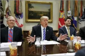  ?? EVAN VUCCI / ASSOCIATED PRESS ?? President Donald Trump, flanked by Senate Majority Leader Mitch McConnell of Ky., left, and House Speaker Paul Ryan of Wis., speaks during a meeting with House and Senate leadership, in the Roosevelt Room of the White House in Washington.