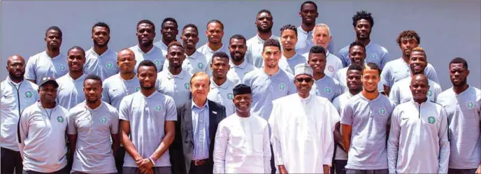  ??  ?? President Muhammadu Buhari (4th right front row) is flanked by Vice-president Yemi Osinbajo and Head Coach Gernot Rohr and Super Eagles players and officials during the team’s farewell visit to the Presidenti­al Villa in Abuja…yesterday