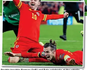  ?? PA ?? Double trouble: Ramsey (left) and Bale celebrate at the whistle