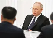  ?? ASSOCIATED PRESS ?? Russian President Vladimir Putin listens to China foreign policy chief Wang Yi during their meeting in Moscow on Wednesday.