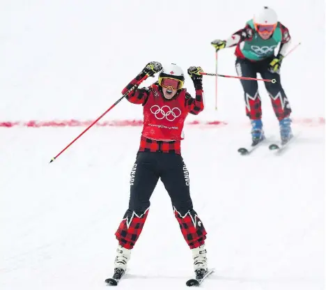  ?? RYAN PIERSE/GETTY IMAGES ?? Kelowna, B.C.’s Kelsey Serwa celebrates winning gold in ski cross Friday at the Pyeongchan­g Winter Games as teammate Brittany Phelan of Mont-Tremblant, Que., crosses the finish line for silver. Four Canadians took part in the event.