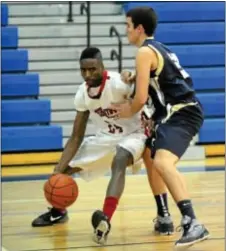  ??  ?? Neshaminy’s Jaylen Pickett (L) tries to dribble past Tom Townsend.