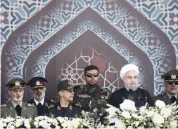  ?? PICTURE: AP ?? WARNING: Iran’s president Hassan Rouhani, second right, says it was possible the country will face problems for two or three months, but will pass through that.