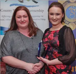  ??  ?? Sergeant Olivia Gleeson presenting an Individual Category Award to Erin Connolly.