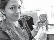  ?? [PHOTO BY ROBERT MEDLEY, THE OKLAHOMAN] ?? Faye Lorenzsonn, a WildCare of Noble staff veterinari­an, holds a screech owl that is recovering after being hit by a vehicle in Wetumka.