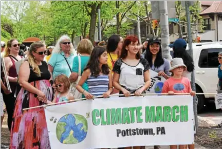  ?? MARIAN DENNIS — DIGITAL FIRST MEDIA ?? Hundreds rallied Saturday along High Street in Pottstown to make their voices heard concerning climate change and the need for better policies. The march was one of hundreds that were taking place around the country to spur change and bring awareness...