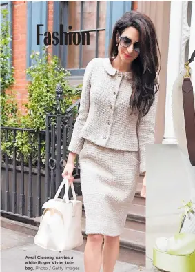  ??  ?? Amal Clooney carries a white Roger Vivier tote bag. Photo / Getty Images