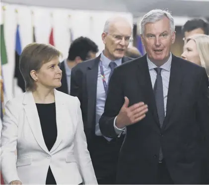  ??  ?? 0 EU chief Brexit negotiator Michel Barnier and Nicola Sturgeon at the European Commission in Brussels last year