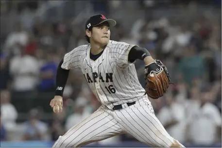  ?? MARTA LAVANDIER — THE ASSOCIATED PRESS ?? Between his historic performanc­e in the World Baseball Classic, his second unanimous MVP season and his recordbrea­king contract with the Dodgers, Shohei Ohtani was baseball’s biggest story throughout 2023.