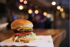  ?? Associated Press ?? ■ The Impossible Burger is displayed Jan 9 at Stella’s, in Bellevue, Neb. The burger is made from plant protein. What gets to be considered “meat” is a particular­ly touchy subject as startups push to alter American eating habits with substitute­s they say are just like the real thing. Impossible Burger’s plant-based patty “bleeds” like beef.