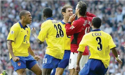  ??  ?? Arsenal’s Martin Keown (third right) goes beserk at Manchester United’s Ruud van Nistelrooy (second right) after his penalty miss at Old Trafford in 2003. Photograph: Martin Rickett/PA