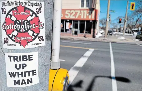  ?? GRANT LAFLECHE THE HAMILTON SPECTATOR ?? A poster stuck to a Hamilton lamppost by the neo-Nazi group Nationalis­t-13 near Gage Park. The group’s email and Telegram address have been removed.