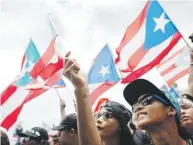  ??  ?? UNA ESTRELLA. La bandera de Puerto Rico se coronó como la única insignia de la manifestac­ión que partió de la Milla de Oro. xavier.araujo@gfrmedia.com