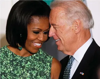  ?? ?? Ready to make way? Joe Biden with former First Lady Michelle Obama