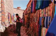  ??  ?? The bright colours of Morocco can be seen at the narrow alleys of the Ait Benhaddou Kasbah.