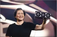  ??  ?? Lisa Su holding the reference Radeon RX 6900 XT.