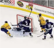  ?? Steve Musco/Contribute­d photo ?? Quinnipiac’s Sam Lipkin, No. 28, scores his second goal of the game just 37 seconds after his first goal, to give the Bobcats a 3-2 lead over Yale on Feb. 17.