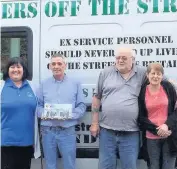  ??  ?? Country’s best The Segton Bar team celebrate their ongoing fundraisin­g success