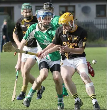 ??  ?? The ball eludes Conor Barlow (Crossabeg-Ballymurn) and Tomás French (Adamstown) in the Permanent TSB Junior ‘B’ hurling championsh­ip final replay in St. Patrick’s Park, Enniscorth­y, on Saturday.