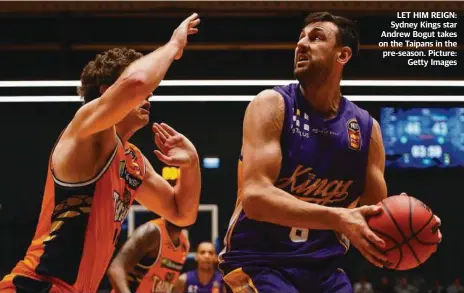  ??  ?? LET HIM REIGN: Sydney Kings star Andrew Bogut takes on the Taipans in the pre-season. Picture: Getty Images