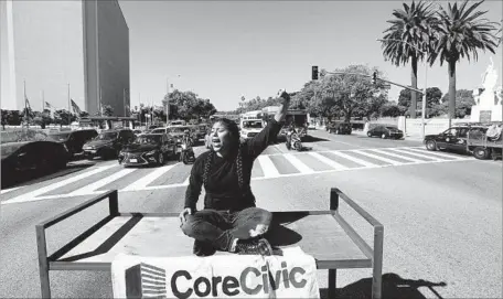  ?? Genaro Molina Los Angeles Times ?? A DEMONSTRAT­OR protests in Westwood atop a metal bunk bed frame, the type commonly seen in immigrant detention facilities.