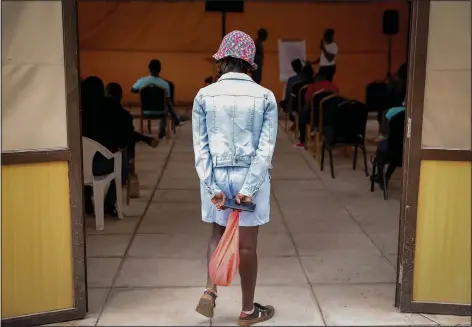  ?? (AP/Brian Inganga) ?? A worshipper arrives for a church service Oct. 17 at the Cosmopolit­an Affirming Community church, which serves a predominan­tly LGBTQ congregati­on, in Nairobi, Kenya.