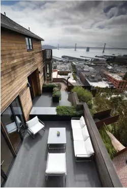  ??  ?? Top The top kitchen terrace affords expansive views across San Francisco Bay. The overlooks can be seen protruding into space below.