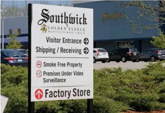  ?? STUART CAHILL PHOTOS/ HERALD STAFF ?? FINANCIAL WOES: Brooks Brothers announced Tuesday it will layoff more than 400 workers at its Southwick manufactur­ing plant in Haverhill.