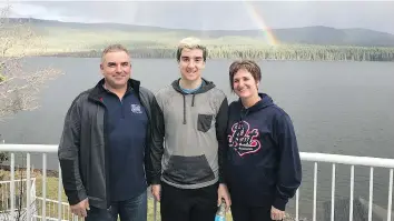  ??  ?? Russ, Adam and Raelene Herold are seen in this undated family photo. Adam was the youngest member of the Humboldt Broncos and had been called up to play at the end of his season with the Regina Pats Canadians.