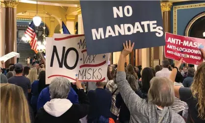  ?? Photograph: David Pitt/AP ?? Protesters at the Iowa capitol in Des Moines push the legislatur­e to pass a bill that would prohibit vaccine mandates from being imposed on workers.