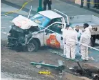  ?? DON EMMERT/AFP/GETTY IMAGES ?? Investigat­ors inspect a truck that plowed into a bike path in Lower Manhattan on Tuesday.