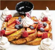  ?? ?? Brioche French Toast from The Florentine restaurant ($15) is available three ways: fresh strawberri­es, raspberrie­s, blueberrie­s & whipped cream (pictured); banana fosters; syrup & powdered sugar.